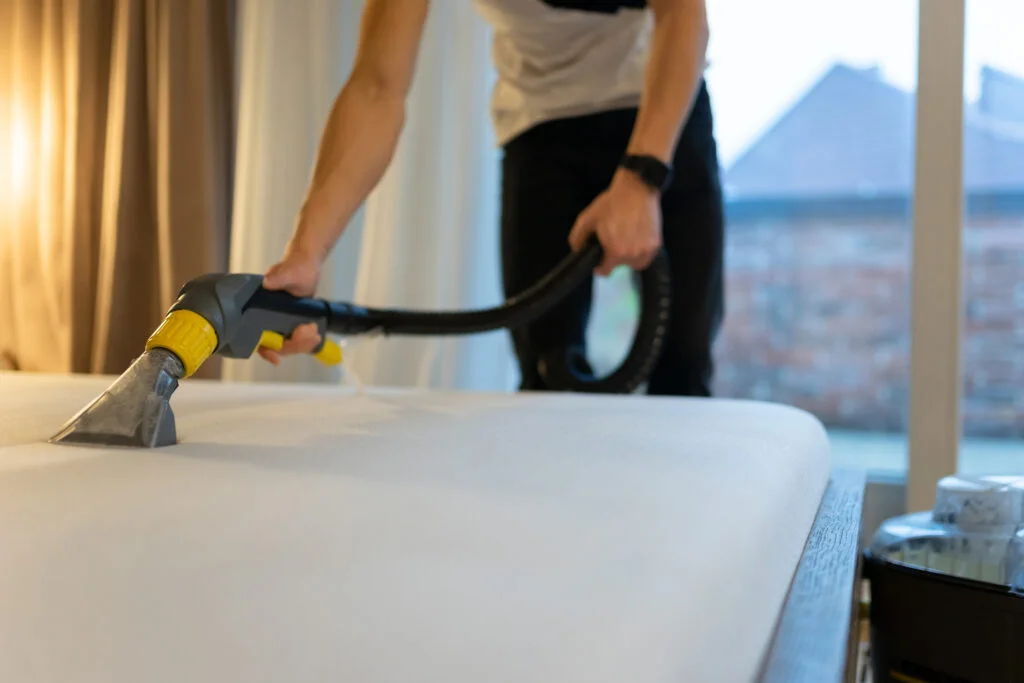 mattress-cleaning-process-man-cleans-bed-from-dir-2023-11-27-05-00-40-utc-1024x683.jpg